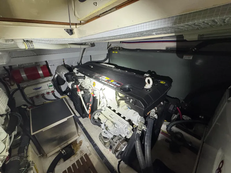 Slide: The Image of Engine room of 2008 Sabre 38 Hardtop Express, showcasing mechanical components and wiring. - 70