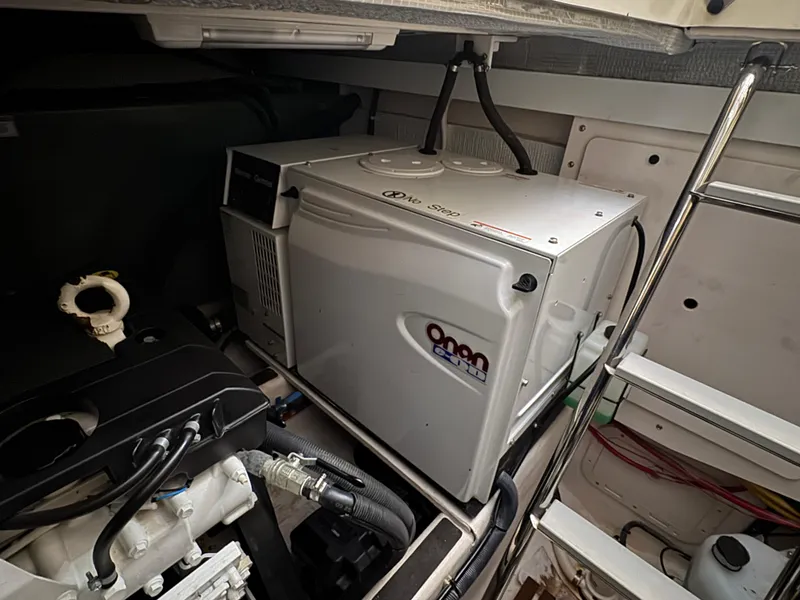 Slide: The Image of Engine room of 2008 Sabre 38 Hardtop Express with generator and mechanical components. - 71