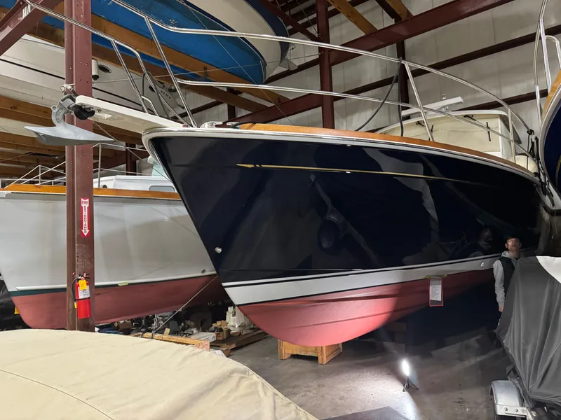 Slide: The Image of 2008 Sabre 38 Hardtop Express boat in indoor storage, showcasing sleek design and craftsmanship. - 75