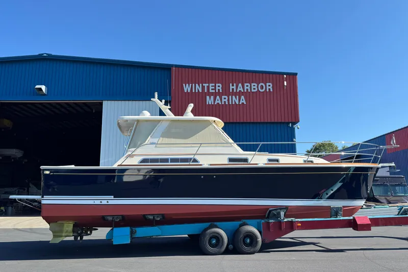 Slide: The Image of 2008 Sabre 38 Hardtop Express at Winter Harbor Marina on trailer. - 88