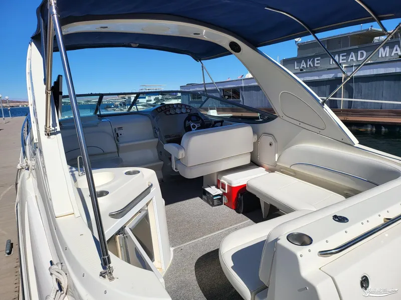 Slide: The Image of 2008 Bayliner 300SB boat interior at Lake Mead Marina, featuring seating and helm. - 15