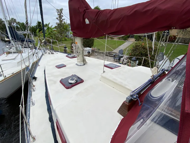 Slide: The Image of Mast of 1986 Bruce Roberts 43 Ketch against cloudy sky. - 11