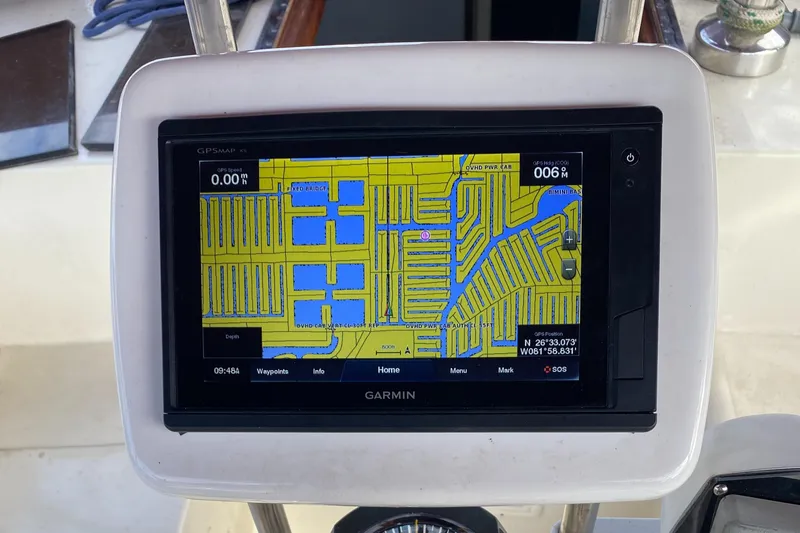 Slide: The Image of Close-up of rigging on a 1986 Bruce Roberts 43 Ketch sailboat docked by water. - 23