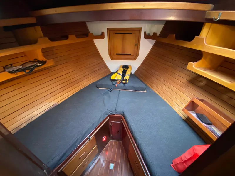 Slide: The Image of Interior of 1986 Bruce Roberts 43 Ketch, featuring navigation station and electrical panel. - 30