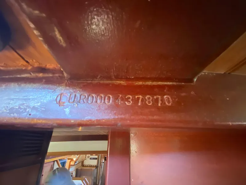 Slide: The Image of Interior of 1986 Bruce Roberts 43 Ketch, featuring cozy seating and wooden finishes. - 31