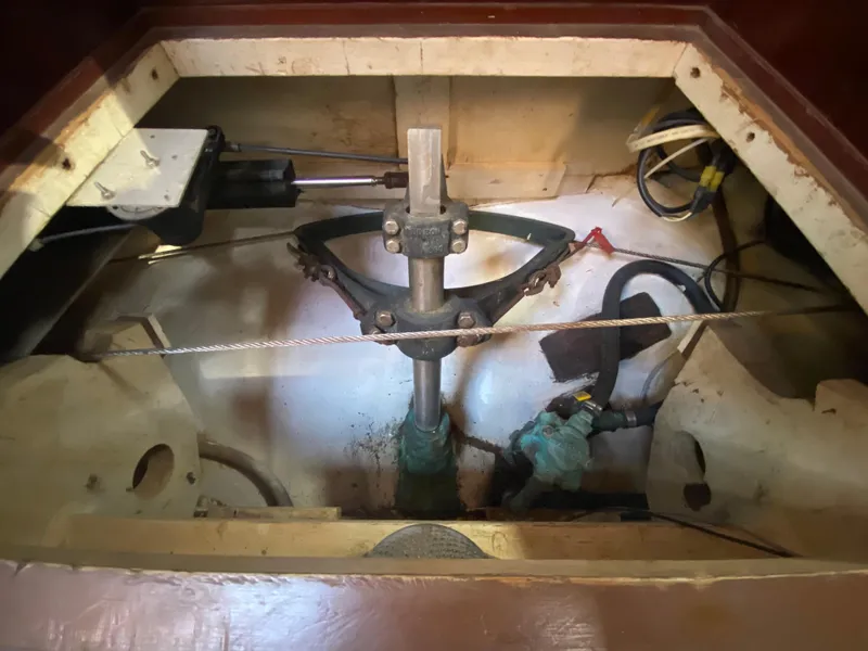 Slide: The Image of Cozy cabin interior of 1986 Bruce Roberts 43 Ketch sailboat with wooden shelves and bedding. - 42