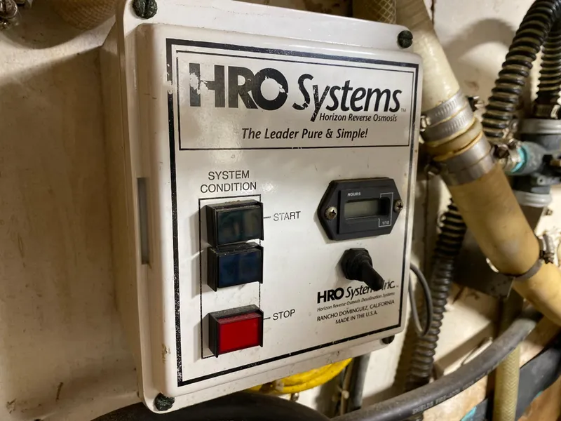 Slide: The Image of 1986 Bruce Roberts 43 Ketch interior with wooden cabinetry and stainless steel stove. - 45