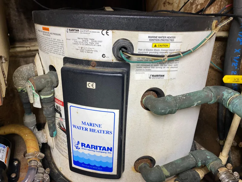 Slide: The Image of Interior compartment of 1986 Bruce Roberts 43 Ketch, featuring storage space and equipment. - 46