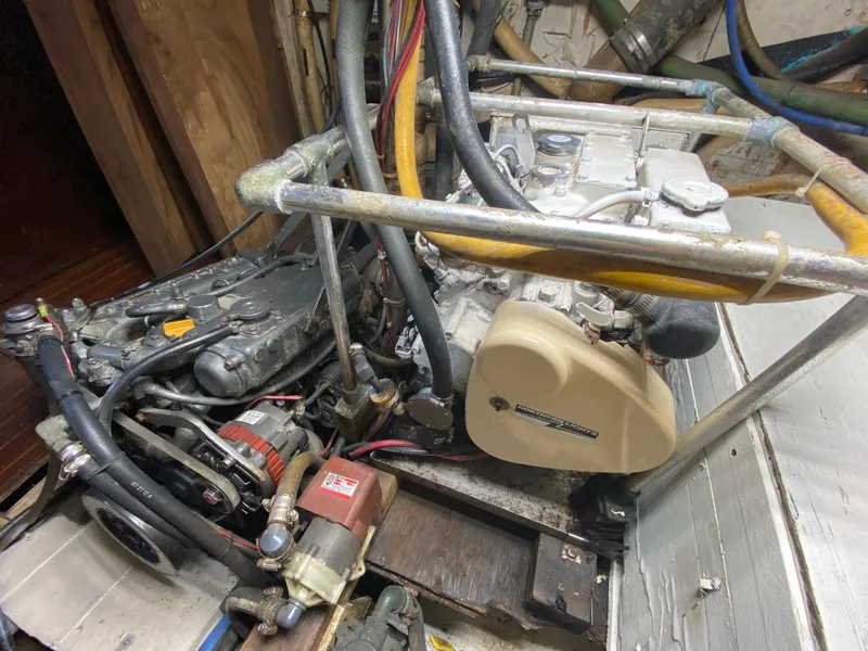 Slide: The Image of Interior of 1986 Bruce Roberts 43 Ketch, featuring wood paneling and built-in storage. - 48