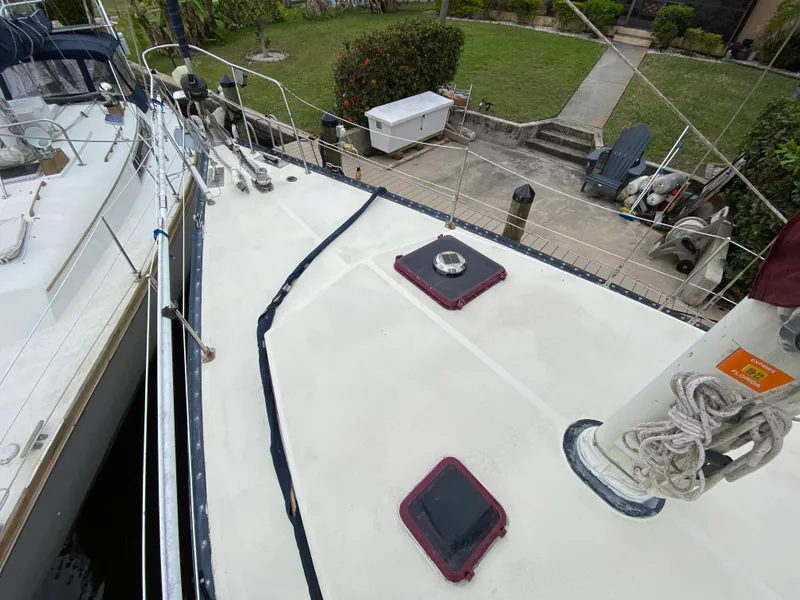 Slide: The Image of 1986 Bruce Roberts 43 Ketch deck view with hatches and mooring ropes. - 6