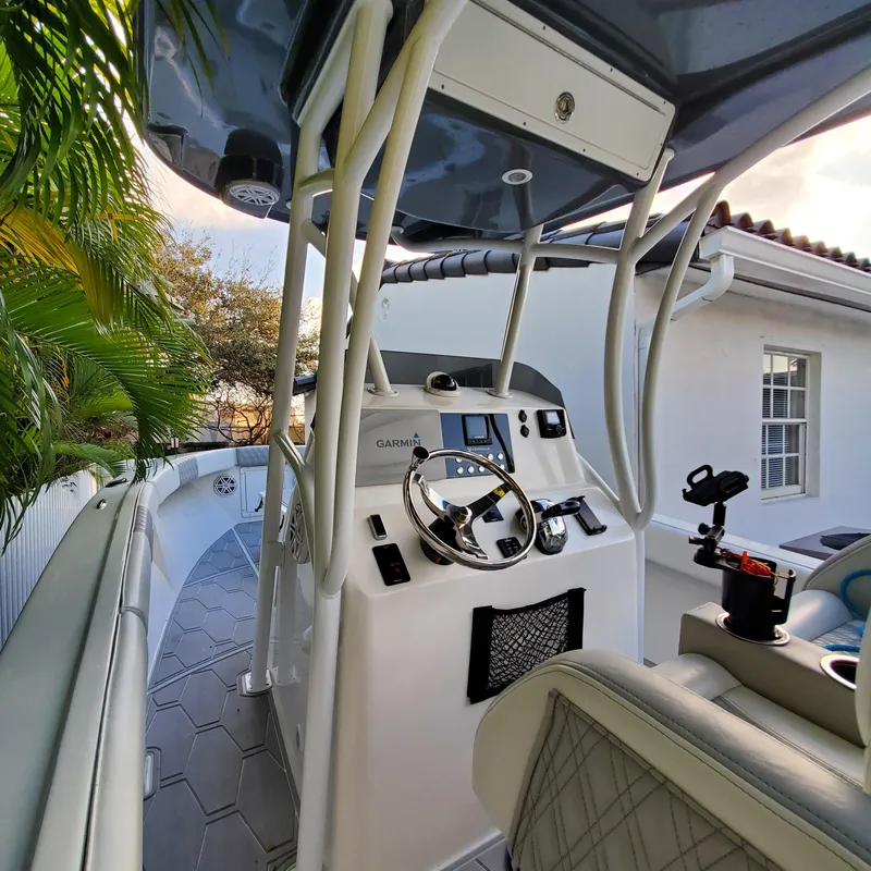 Slide: The Image of 1976 Formula 233 boat cockpit with modern controls and steering wheel. - 2