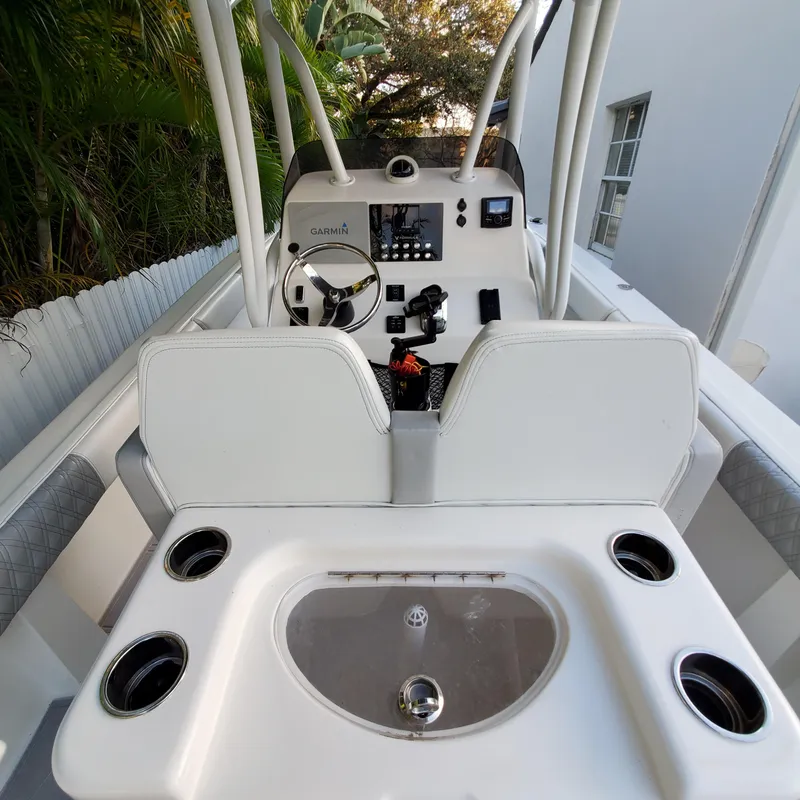 Slide: The Image of 1976 Formula 233 boat cockpit with steering wheel and control panel. - 4