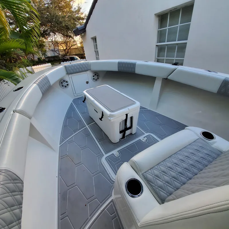 Slide: The Image of Interior of a 1976 Formula 233 boat with modern seating and cooler. - 9