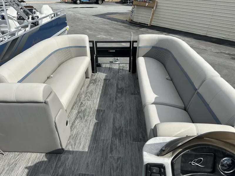 Slide: The Image of 2023 Qwest Pontoons XRE Cruise 22 interior with gray seating and flooring. - 11