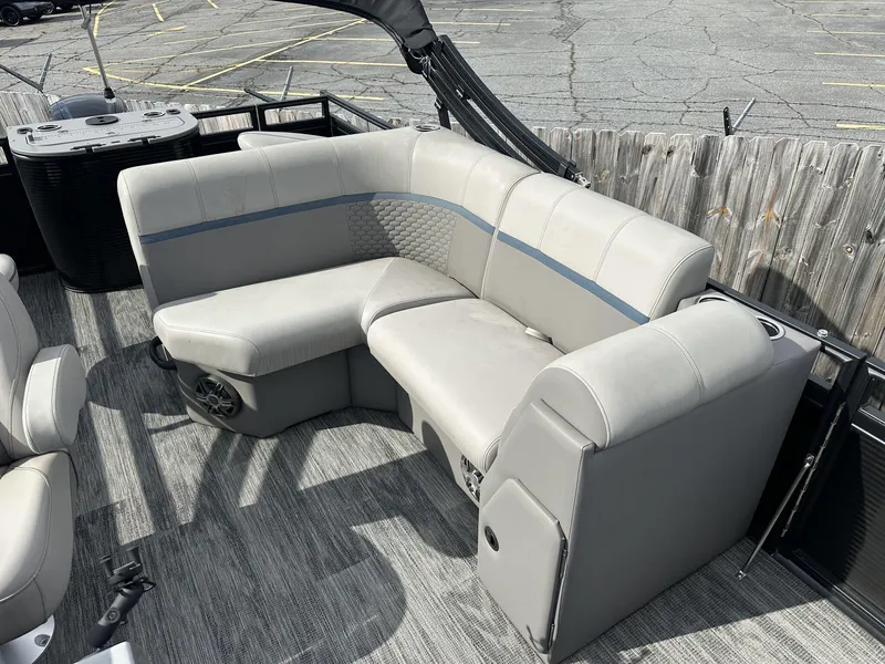 Slide: The Image of 2023 Qwest Pontoons XRE Cruise 22 interior with gray seating and modern design. - 3