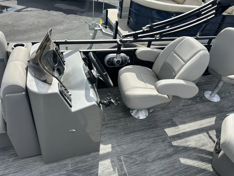 Slide: The Image of 2023 Qwest Pontoons XRE Cruise 22 interior with helm and seating. - 8