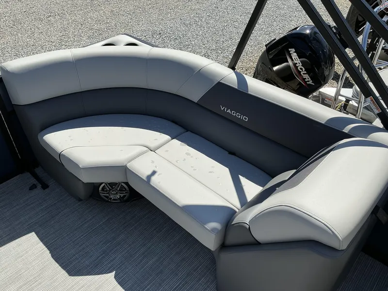 Slide: The Image of 2025 Viaggio Lago V 22U boat interior with gray seating and Mercury engine. - 10