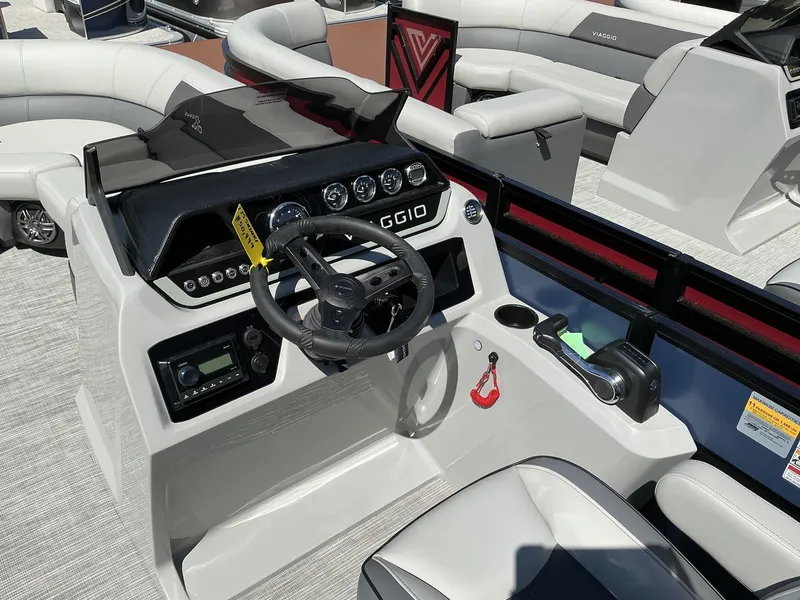 Slide: The Image of Viaggio Lago V 22U 2025 boat dashboard with steering wheel and controls. - 9