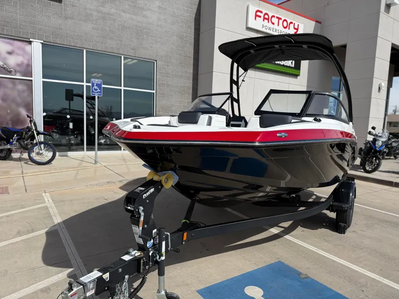 Slide: The Image of 2025 Yamaha Boats AR195 on trailer outside dealership. - 12