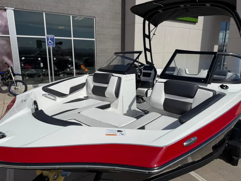Slide: The Image of 2025 Yamaha Boats AR195 with sleek design and modern seating, displayed outdoors. - 13