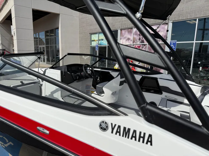 Slide: The Image of 2025 Yamaha AR195 boat, sleek design, showcased outdoors, featuring modern interior and branding. - 17