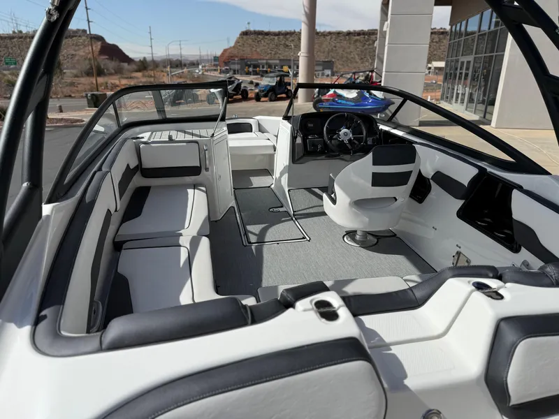 Slide: The Image of 2025 Yamaha Boats AR195 interior with modern seating and steering console. - 20