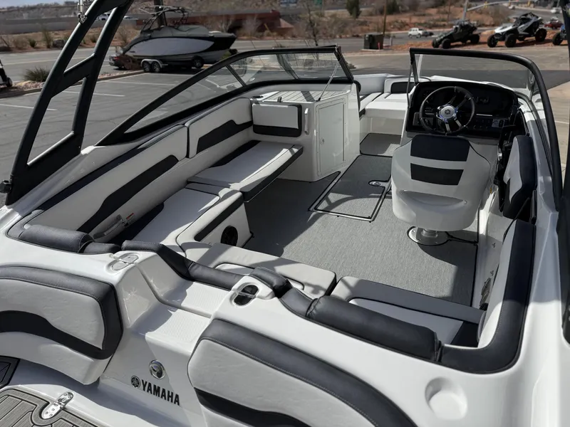 Slide: The Image of 2025 Yamaha Boats AR195 interior with sleek seating and modern dashboard design. - 21