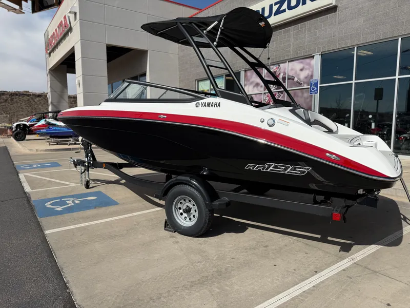 Slide: The Image of 2025 Yamaha Boats AR195 on trailer, parked outside dealership. - 3