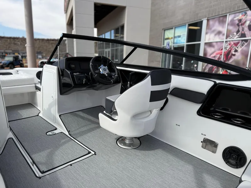 Slide: The Image of 2025 Yamaha Boats AR195 interior with sleek steering and modern seating design. - 34