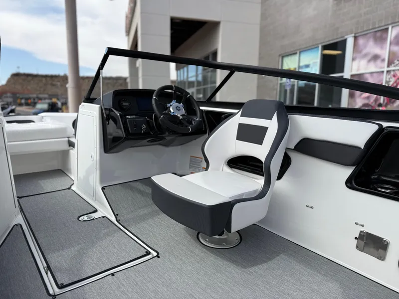 Slide: The Image of 2025 Yamaha Boats AR195 interior with sleek steering and modern seating design. - 35