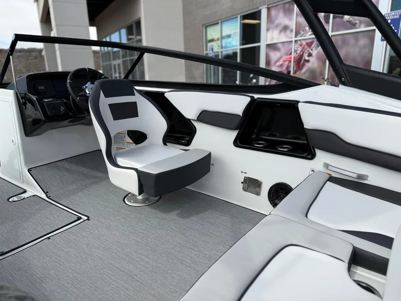 Slide: The Image of 2025 Yamaha Boats AR195 interior with sleek seating and modern dashboard design. - 36