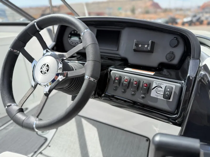 Slide: The Image of 2025 Yamaha Boats AR195 dashboard with steering wheel and control panel. - 39