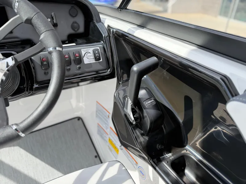 Slide: The Image of 2025 Yamaha Boats AR195 cockpit with steering wheel and control panel. - 40