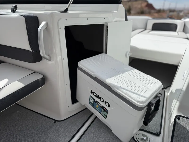 Slide: The Image of 2025 Yamaha AR195 boat interior with Igloo cooler storage compartment. - 42