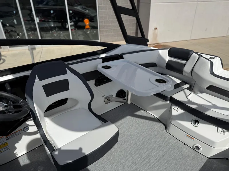 Slide: The Image of 2025 Yamaha Boats AR195 interior with seating and table setup. - 44