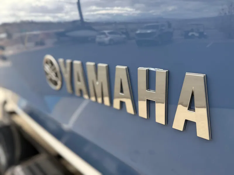 Slide: The Image of Close-up of Yamaha logo on 2025 Yamaha Boats AR220. - 10