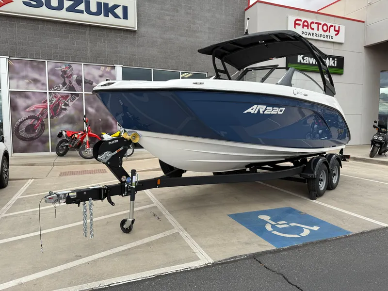 Slide: The Image of 2025 Yamaha Boats AR220 on trailer at dealership parking lot. - 14