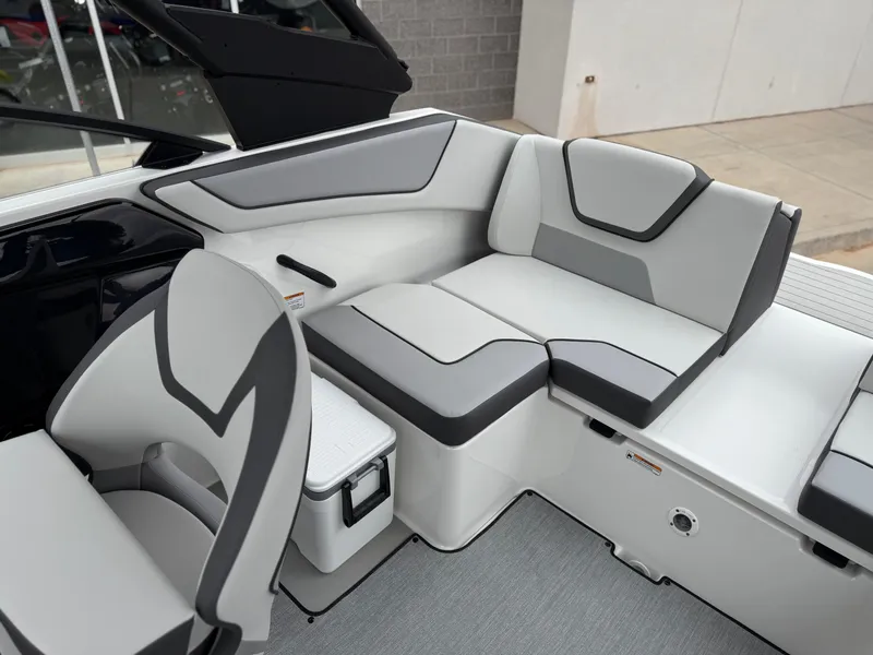 Slide: The Image of 2025 Yamaha Boats AR220 interior seating with modern gray and white design. - 29