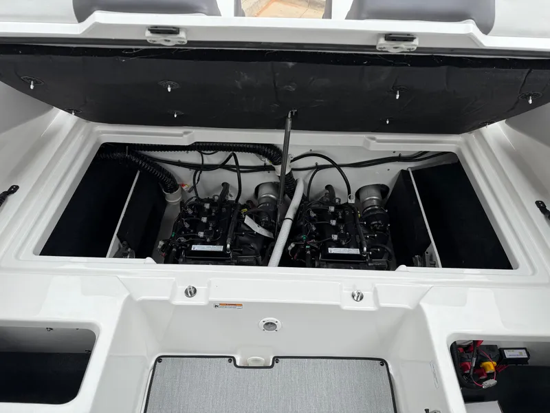 Slide: The Image of 2025 Yamaha Boats AR220 engine compartment with dual engines and wiring. - 33