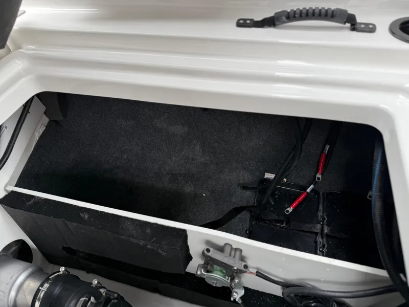 Slide: The Image of 2025 Yamaha Boats AR220 engine compartment with visible wiring and components. - 36