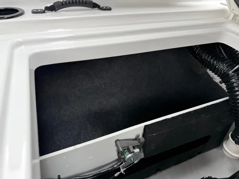 Slide: The Image of Storage compartment of 2025 Yamaha Boats AR220, featuring sleek design and durable materials. - 41