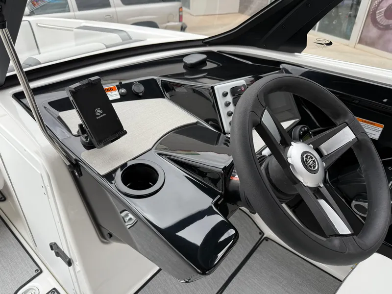 Slide: The Image of 2025 Yamaha Boats AR220 dashboard with steering wheel and control panel. - 46