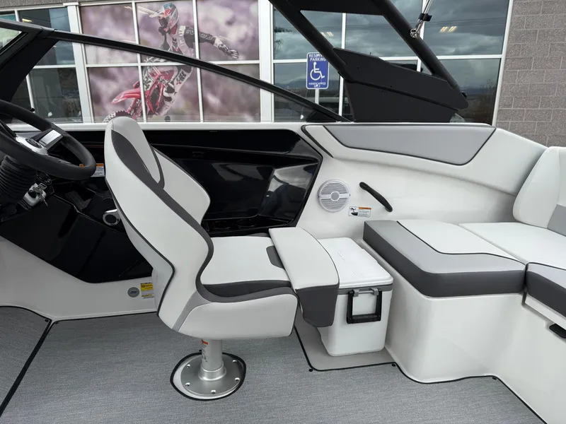 Slide: The Image of 2025 Yamaha Boats AR220 interior with gray seating and modern design. - 48