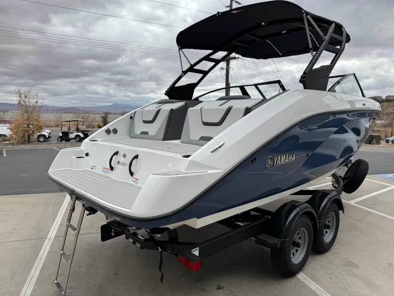 Slide: The Image of 2025 Yamaha Boats AR220 on trailer, featuring sleek design and modern amenities. - 5