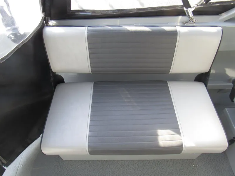 Slide: The Image of 2015 Hewescraft 180 Sportsman boat seat, gray and white upholstery, interior view. - 14