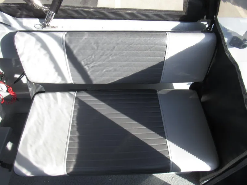 Slide: The Image of 2015 Hewescraft 180 Sportsman boat interior with gray seating. - 15