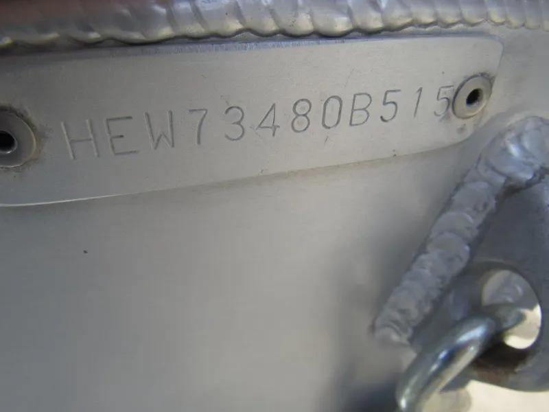Slide: The Image of HIN plate on 2015 Hewescraft 180 Sportsman boat, showing serial number. - 17