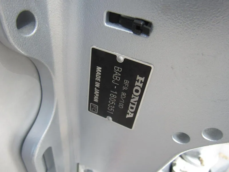 Slide: The Image of Honda engine plate on Hewescraft 180 Sportsman, 2015 model, made in Japan. - 19