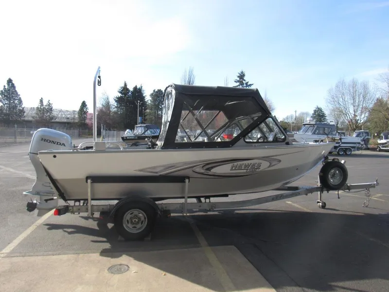 Slide: The Image of 2015 Hewescraft 180 Sportsman boat with Honda outboard motor on trailer. - 6