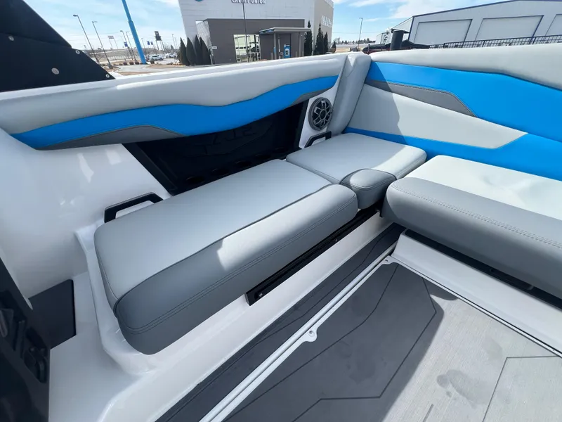 Slide: The Image of 2023 Axis Wake Research T220 boat interior with blue and gray seating. - 12